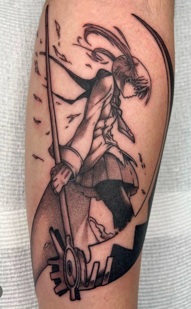 Manga-style figure swinging a scythe, black and grey on a calf.